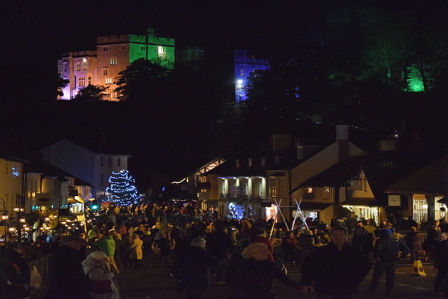 Dunster illuminated by glowing lights