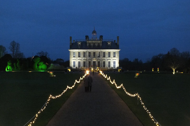 View up to Kingston Lacy with path lined with lights