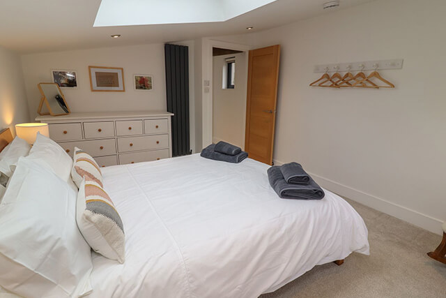 Property management service for a holiday let - Primrose barn bedroom with new linen and towels ready for changeover.