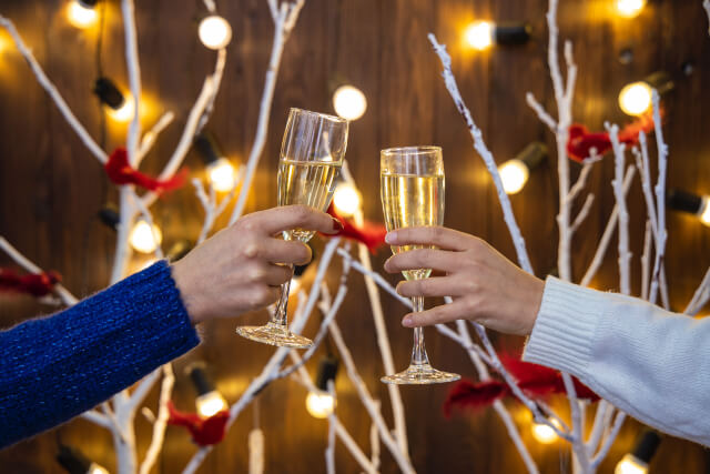 Friends toasting glasses on New Years Eve.