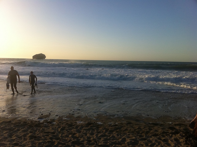 Surfers on Portreath Beach