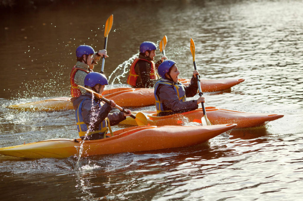 A family kayaking on the River Dart near Dittisham Devon