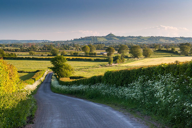 Where to invest in a property in the Westcountry - view of the somerset levels with windy road.