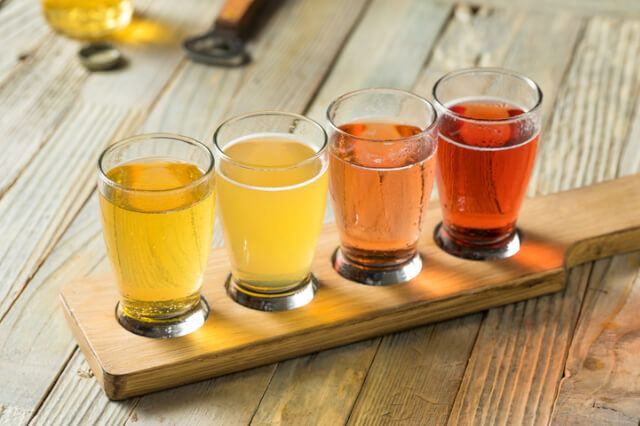 Flight of four different ciders.