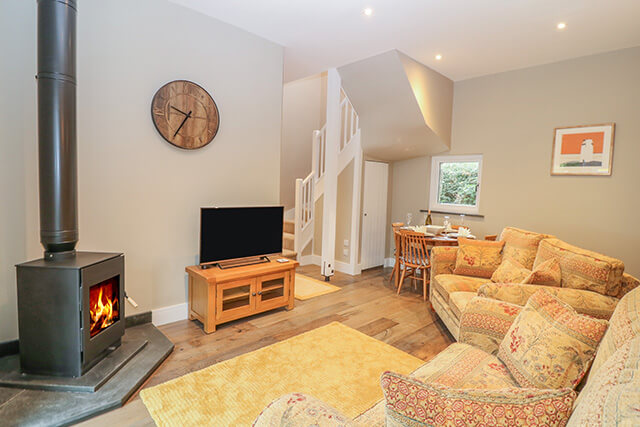 log burner in maple cottage