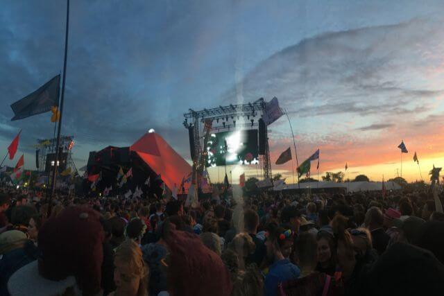A view of the pyramid stage at sunset at Glastonbury Festival.