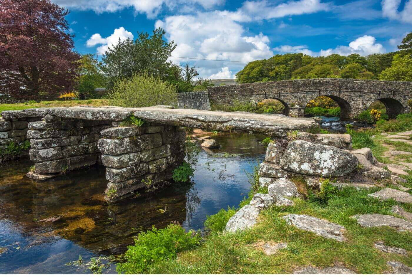 Medieval clapper bridge over the East Dart River at Postbridge on Dartmoor in West Country.