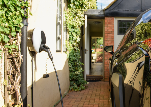 Electric vehicle charge point at a property