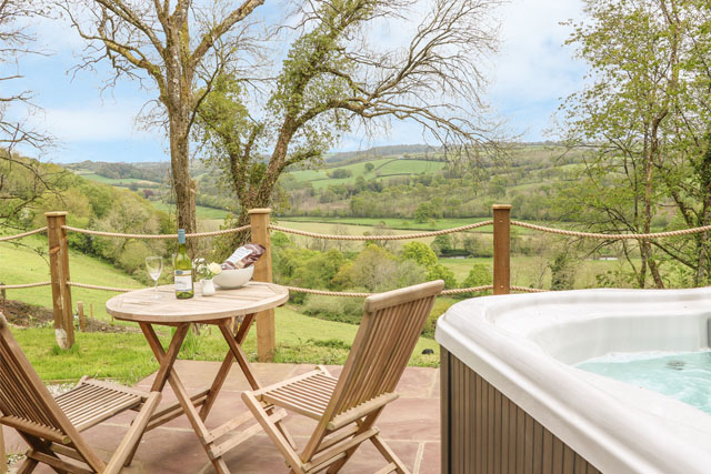 Rolling countryside view from the hot tub at Little Silver Owl, High Bickington