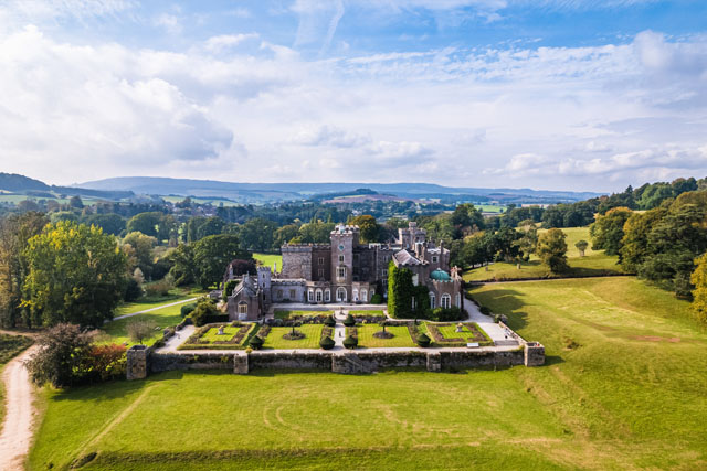 An aerial view of Powderham Castle and surrounding green fields