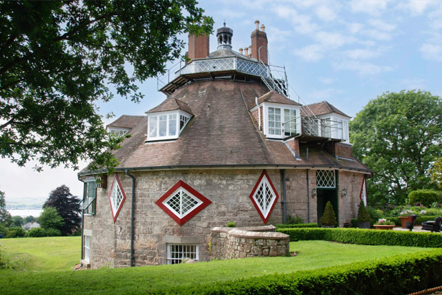 Outside view of A La Ronde, a historic 16-sided house, and it's surrounding gardens