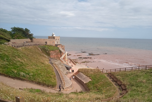 A steep path down to the sea, overlooked by a large white staircase at Jacob's Ladder Beach, Sidmouth