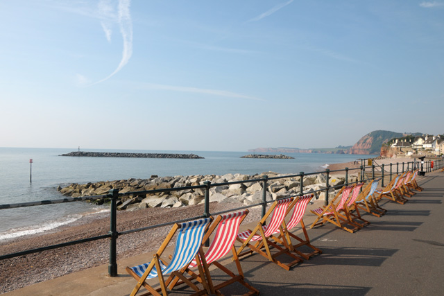 Deckchairs along Sidmouth Seafront on a sunny day