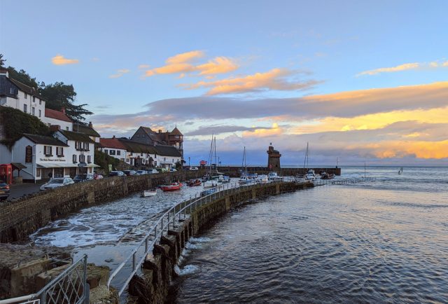 View of Lynmouth harbour and the sea at sunset