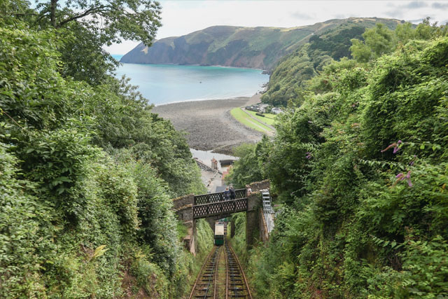 View of sea and cliffs, plus railway track in the foreground, looking down from the Lynton and Lynmouth Cliff Railway.